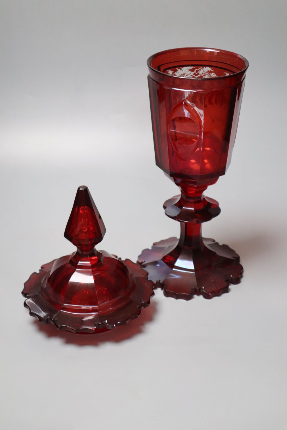 A large Bohemian wheel engraved ruby flash glass vase and cover decorated with deer, late 19th century, 43.5cm